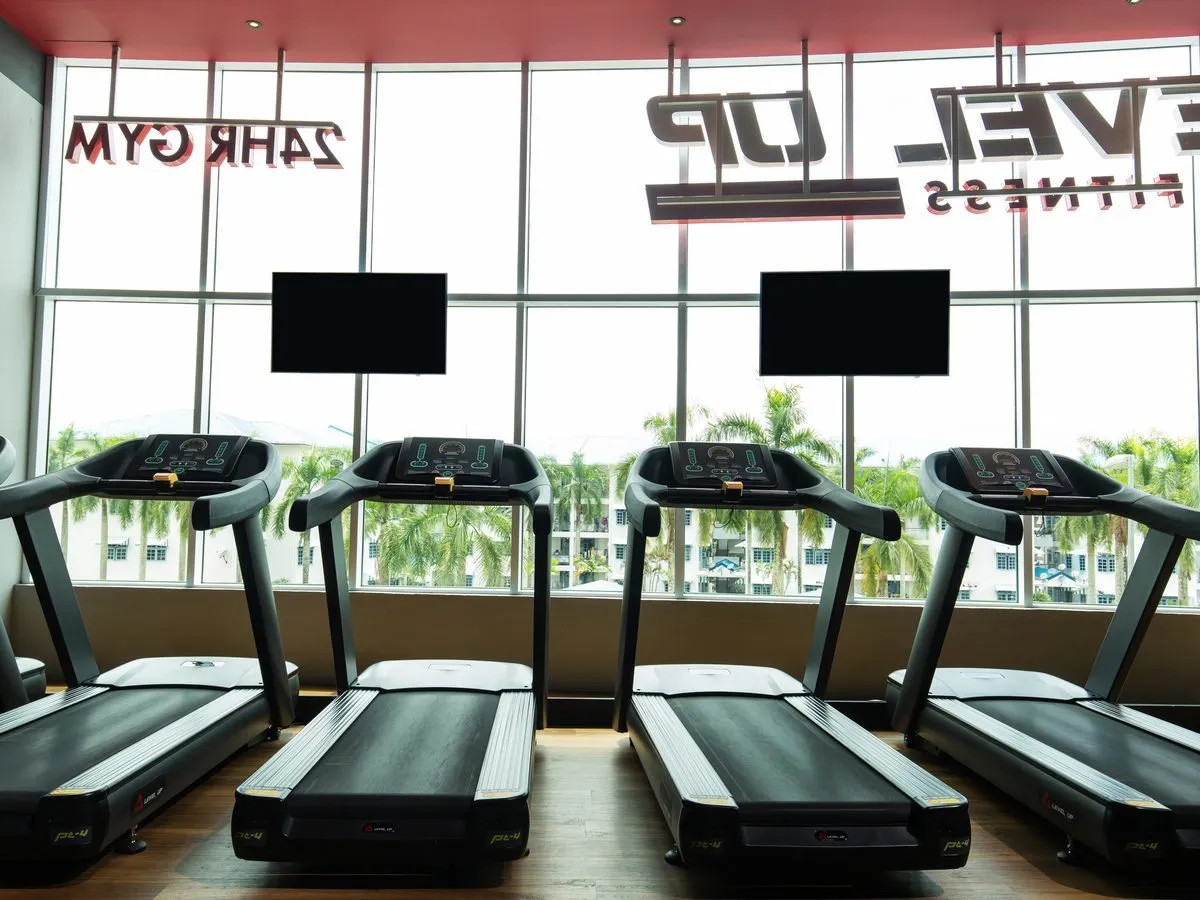 Treadmills by the window at Level Up Fitness Xpress AEON Mall Kuching Central